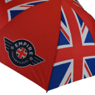Brightly printed double canopy golf umbrella with union jack flag and Empire Coach Builders logo on red background
