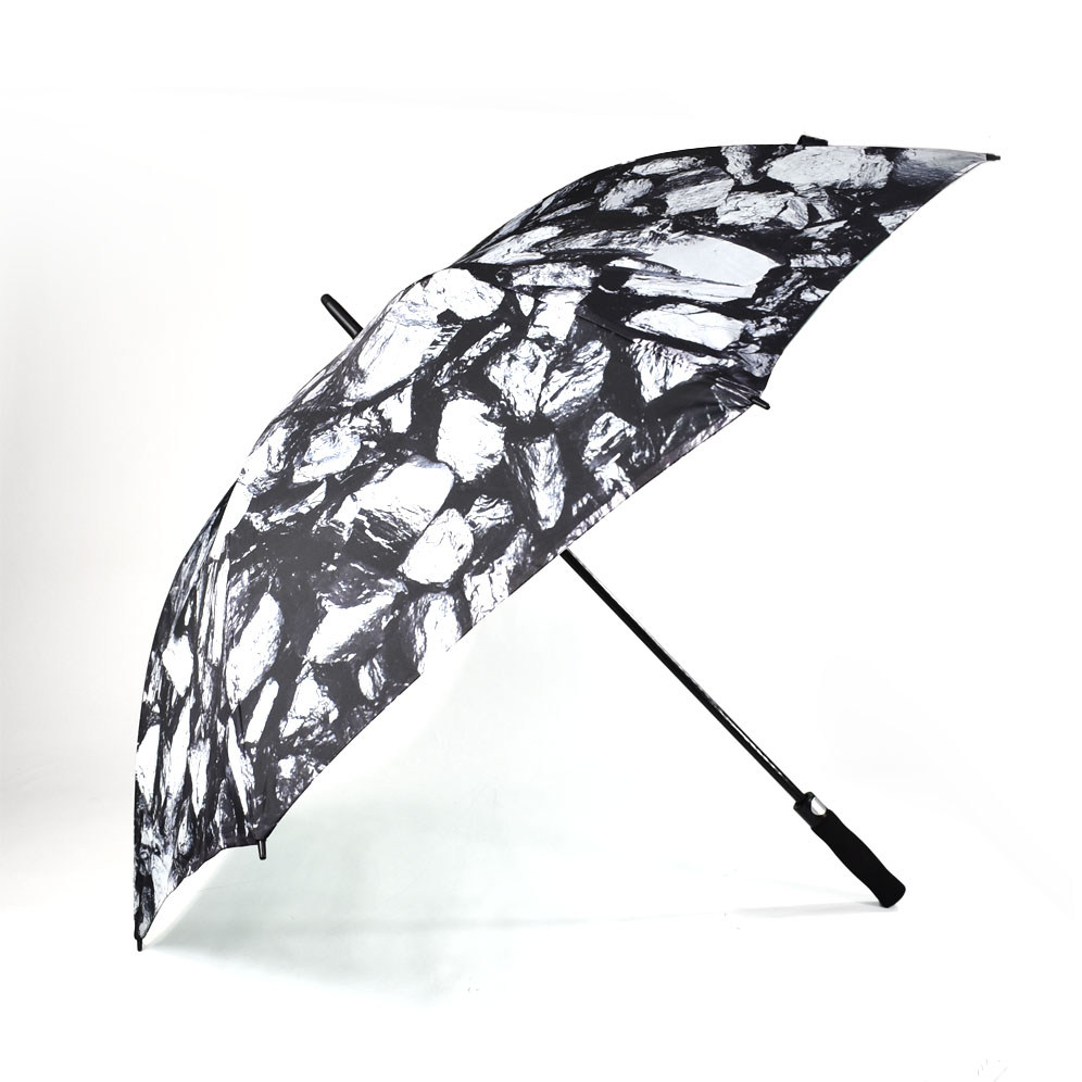 black and white print on outside of large golf umbrella