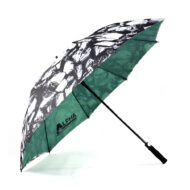 printed large gold umbrella with black and white print on outside of umbrella and green on inside