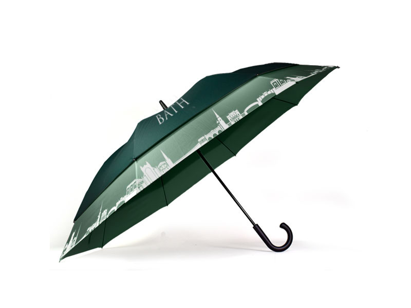 side view of white and green umbrella with black curve handle