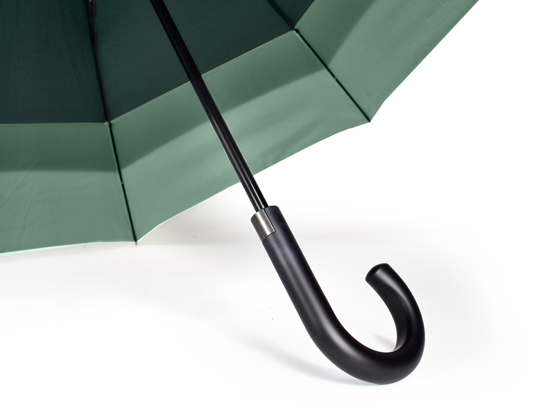 black curve handle on walker umbrella with green umbrella panels