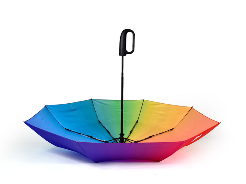 upside down open rainbow umbrella with black clip handle