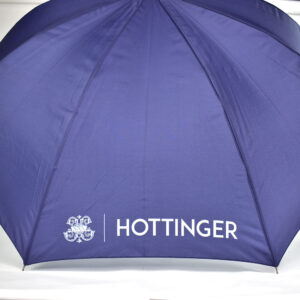 Purple umbrella with white text print that says HOTTINGER with logo icon