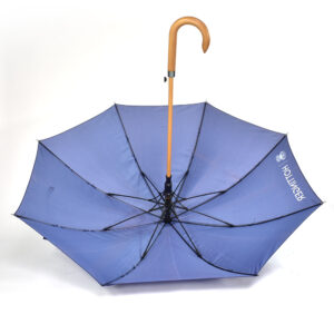 Purple umbrella displayed open with the inside umbrella panels showing and displaying the black umbrella rib structure and wooden pole with curve handle 