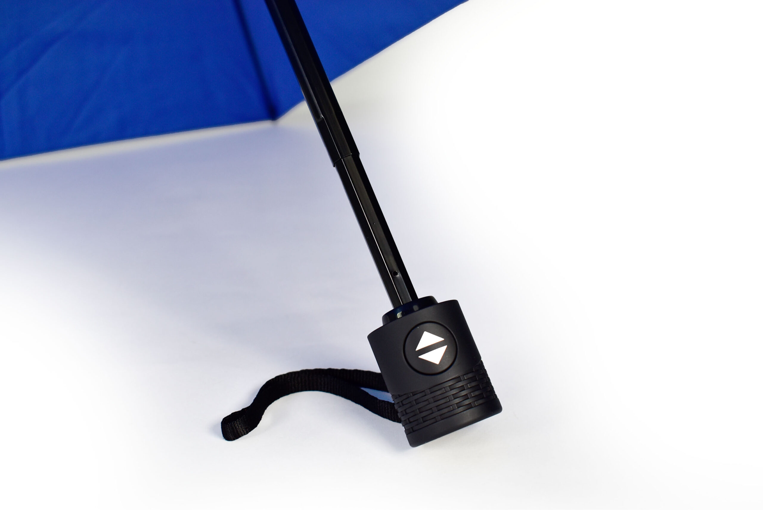 small black umbrella handle with push button to open and carry handle strap