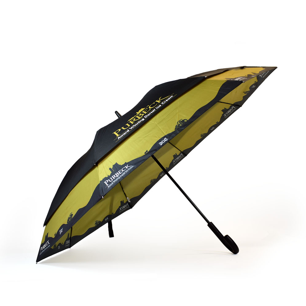 vented umbrella side view printed yellow and black with skyline around the bottom of the umbrella panels